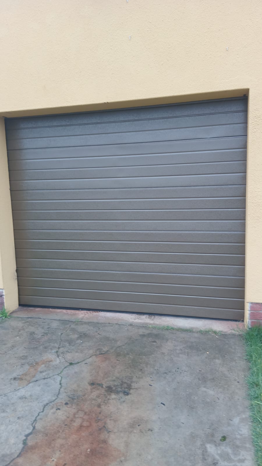 Bronze sectional garage door fitted to a Cape Town home