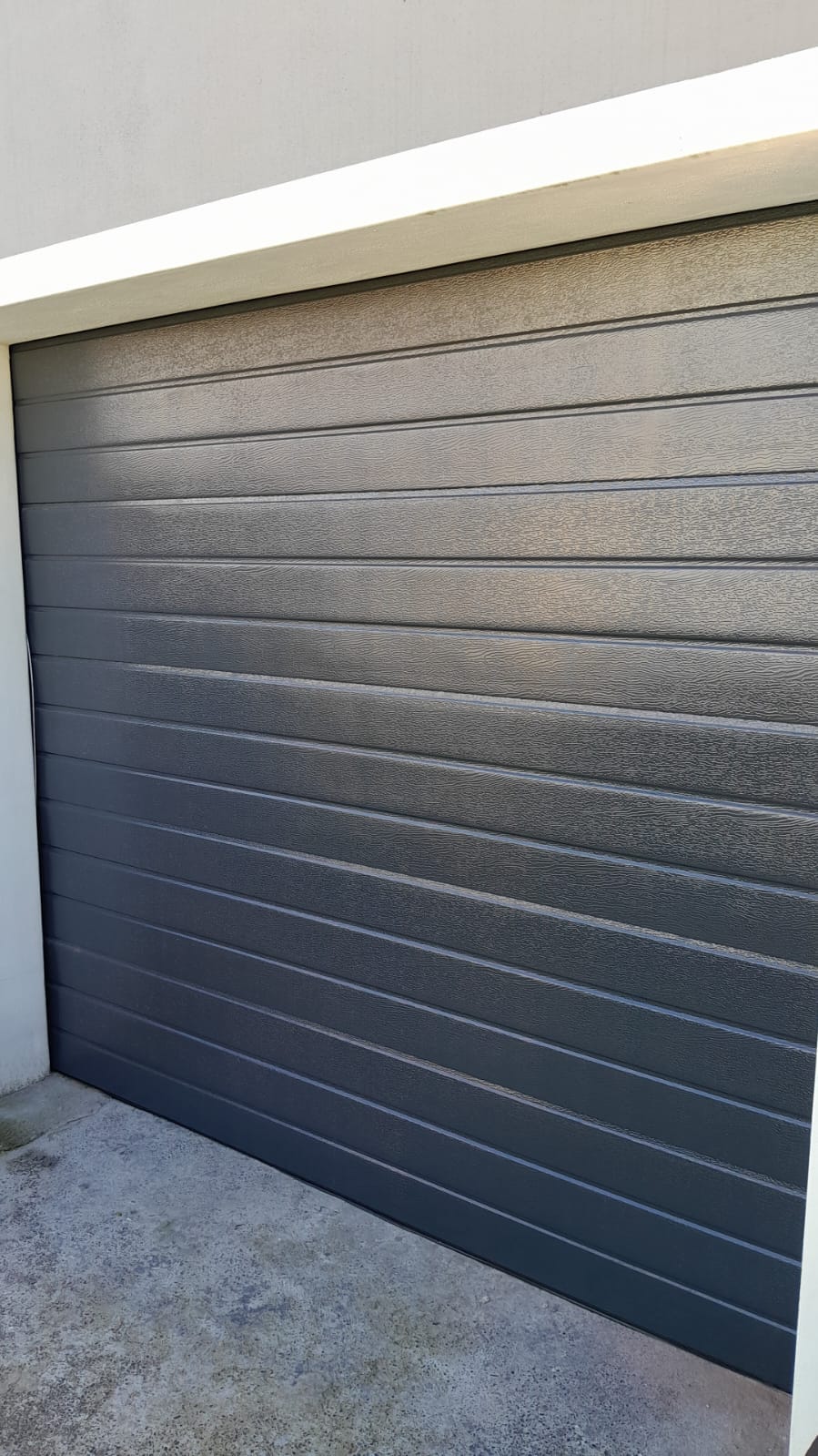 Textured charcoal sectional garage door